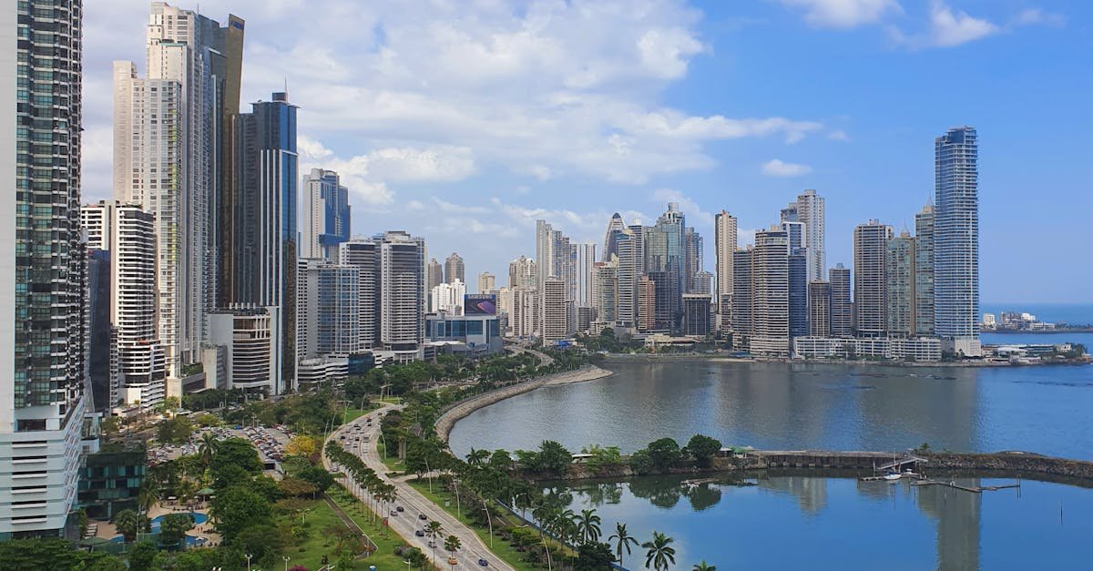 A breathtaking view of Panama City's modern skyline and oceanfront under a blue sky.